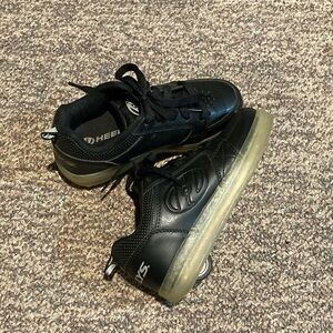 Heelys black shoes with one scuff on the one toe.